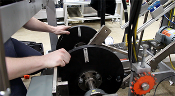 An employee working on a machine