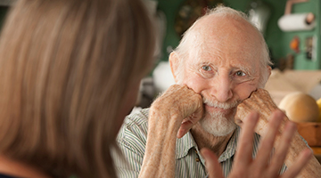 An aging adult listening to someone 
