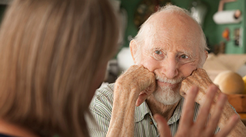 An aging adult listening to someone