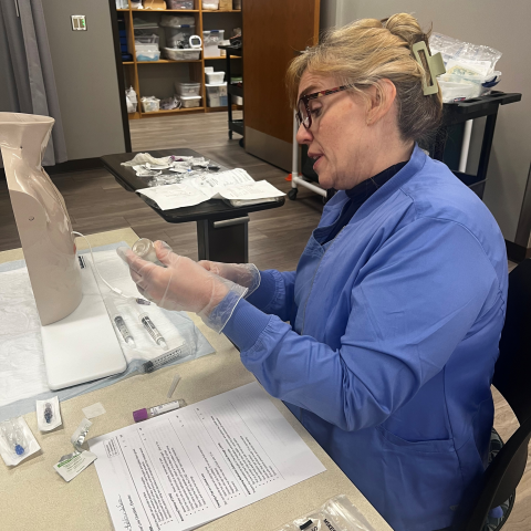 Nursing student Bobbie Jo Selin is photographed working on hands-on skills in one of her nursing courses.