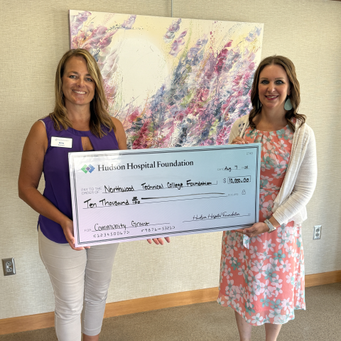 Erika Schendel, right, presented a $10,000 donation check to Kim Pearson, left.
