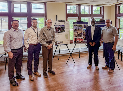 Brett Gerber, Luke Bierl, Gov. Evers, Elmer Moore Jr., and John Will posed indoors at Trailview Cottages discussion in Hayward.