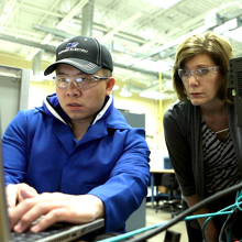 Student receiving guidance from instructor