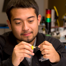 A student using hand held equipment