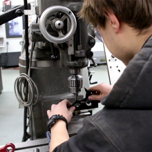 Machining student working on machine