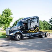 Truck driving student sitting in the Northwood Tech Semi