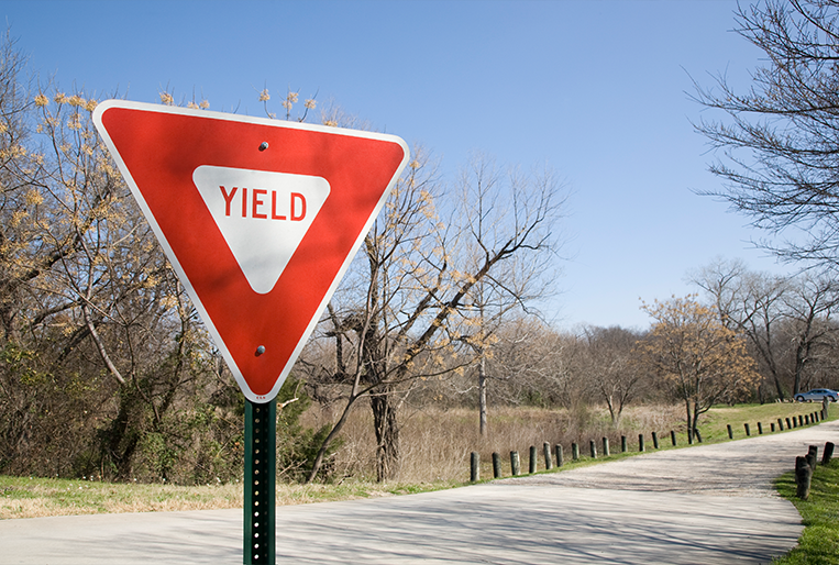 Above Content Image Yield sign on a town road