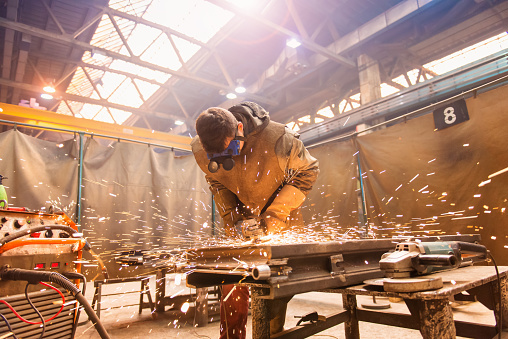 A welder working in the shop