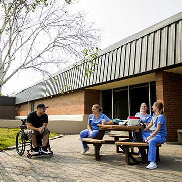 Group of students hanging out outside