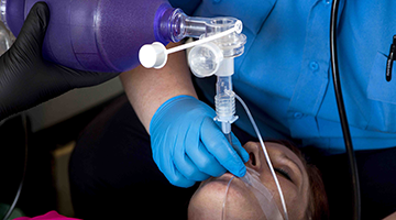 Advanced EMT student practicing Cardiopulmonary resuscitation on a real person