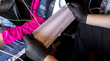 An EMT student looking at a print out of a heart rate